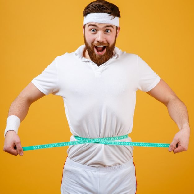 https://drzaar.com/wp-content/uploads/2023/11/happy-bearded-fitness-man-measuring-his-waist-with-tape-e1701092822673.jpg